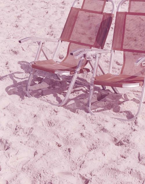 Two beach chairs on a beach