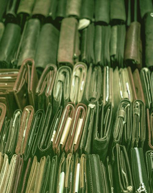 Close up of a market stall with lots of leather wallets